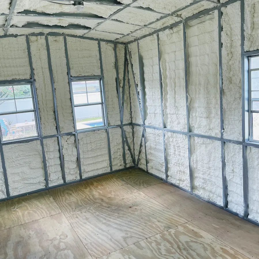 Closed-cell spray foam insulation applied to wall cavities in a residential project in Versailles